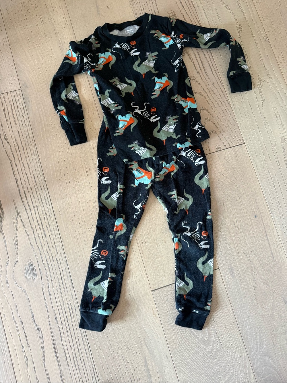 Carter's Black Dinosaur Print Kids Footed Pajama Set with Orange & Green Accents